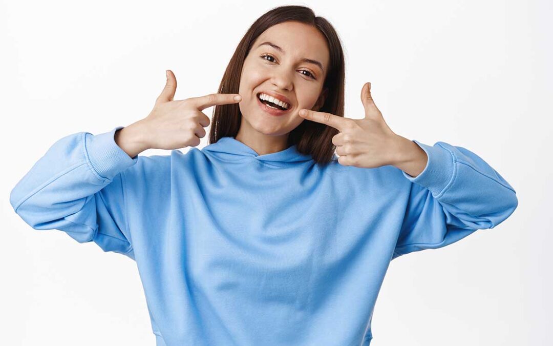 How can I make my teeth look straight without orthodontics?