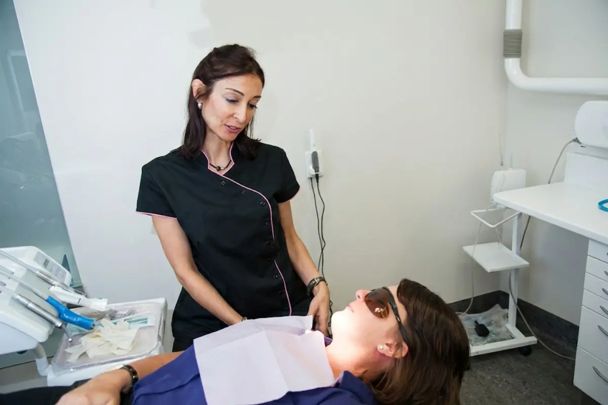 Dentist in Maroubra Sydney examining a patient during a routine dental check up, assessing gum health, enamel condition, bite alignment, and overall oral hygiene in a modern dental clinic.